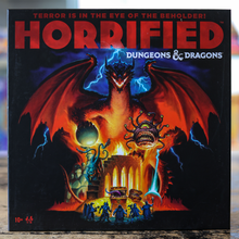 Load image into Gallery viewer, The front of the board game box for 'Horrified: Dungeons &amp; Dragons' is shown, featuring dramatic fantasy artwork of a red dragon with glowing blue lightning over a fiery scene and small figures at the bottom.
