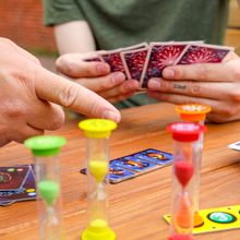 Load image into Gallery viewer, Someone pointing at the game pieces.
