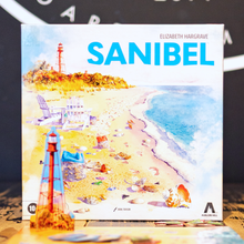 Load image into Gallery viewer, Box cover of 'Sanibel' by Elizabeth Hargrave with a beach scene illustration.
