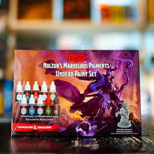 Load image into Gallery viewer, D&amp;D Nolzur's Marvelous Pigments Undead Paint Set packaging with figurines on a blurred background
