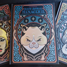 Load image into Gallery viewer, A boxed card game or art box featuring illustrated card backs. The front box is titled "Boo's Astral Menager II" and shows a stylized cat face with stars and ornate blue, black, and peach artwork.
